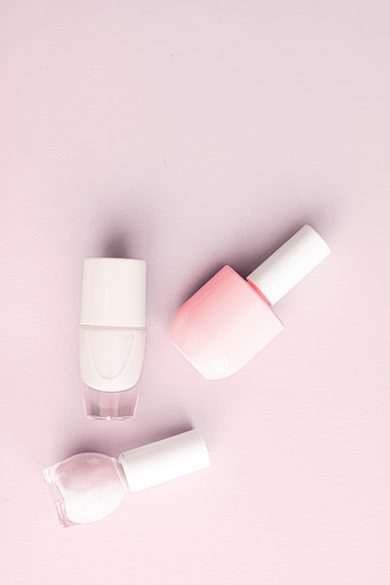 Nail Polish Bottles on Blush Pink Background, Beauty Brand